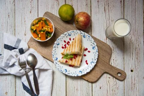Boiled vegetables with bread and condiments on a background with a top view Stock Photos
