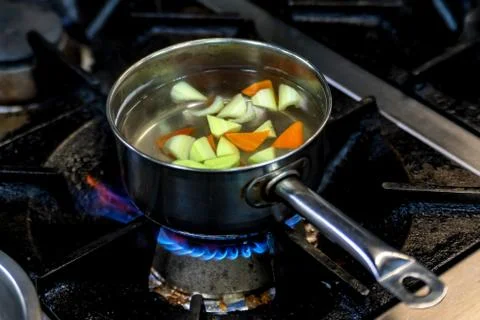 Boiled vegetables in saucepan Stock Photos