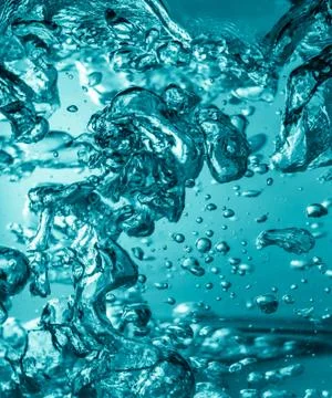Boiled water with bubbles background Stock Photos