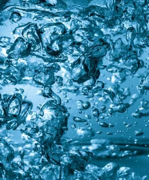 Boiled water with bubbles background Stock Photos