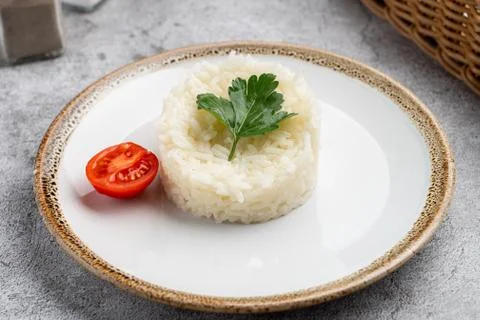 Boiled white plain rice as a simple garnish in a cafe Stock Photos