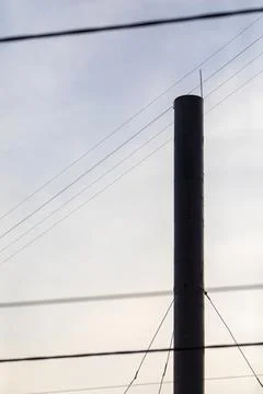 Boiler house chimney at sunset sky background Stock Photos
