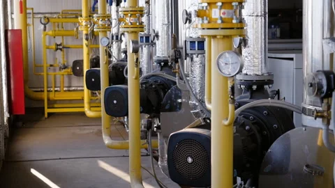 Boiler room or a technical room with hot pipes. 库存影片 131314254