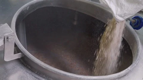 Boiling and brewing the grain ingredient inside of a tank for beer manufacturing Stock Footage 282785188