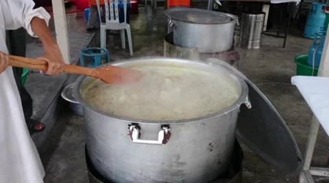 Boiling and stirring process of Malaysia Ramadhan cuisine, Bubur Lambuk Stock Footage 39923990