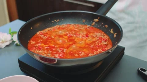 Boiling appetizing chili con carne in a deep wok pan Stock-Footage 252459825