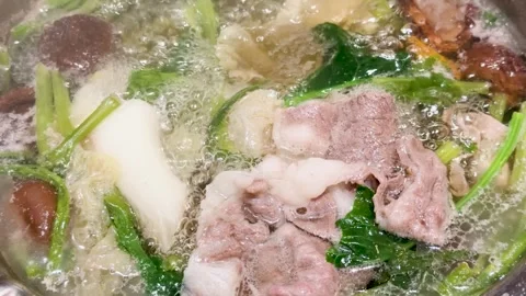 Boiling Asian Hotpot with Beef, Vegetables, and Mushrooms Stock-Footage 319972827