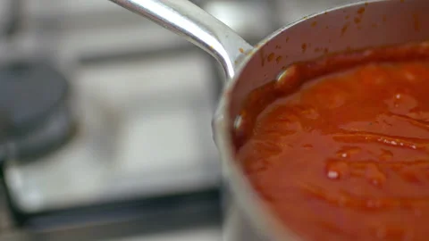 Boiling barbecue sauce with different ingredients, spices in a bowl in 4K. Stock Footage 135993447
