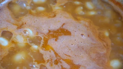 Boiling bean soup in a pan Stock Footage 127060975