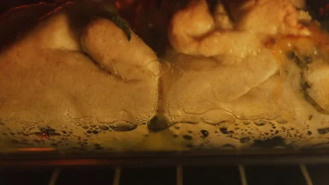 Boiling bread bombs in transparent glass pan in oven close-up Stock Footage 140599745