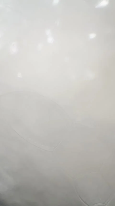 Boiling Broth Steam and Condensation Under Glass Lid Close Up Video stock 334620153