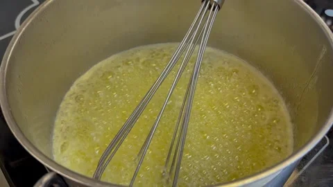 Boiling Butter Sizzling and Foaming in Pot for Browning Stock Footage 344881530