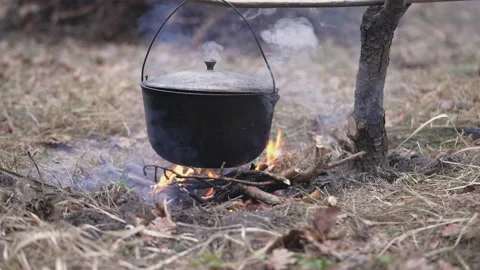 Boiling cauldron that hangs over the fire Stock-Footage 234539656