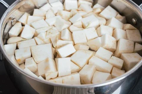 Boiling Celeriac Cubes in Water for Mashed Preparation Stock Photos