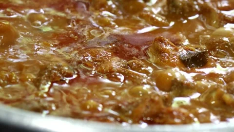 Boiling chicken curry close-up Stock Footage 252052421