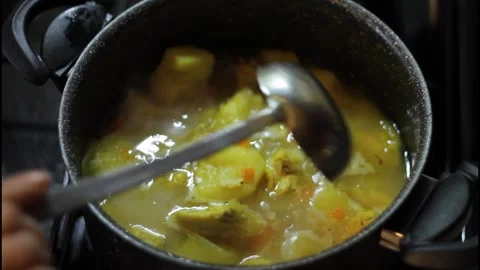 Boiling chicken with potatoes in a pot Stock Footage 297958910