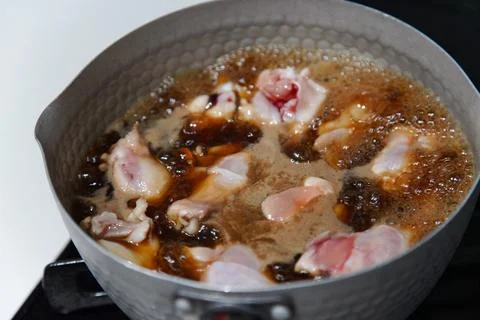 Boiling chicken wings Stock Photos