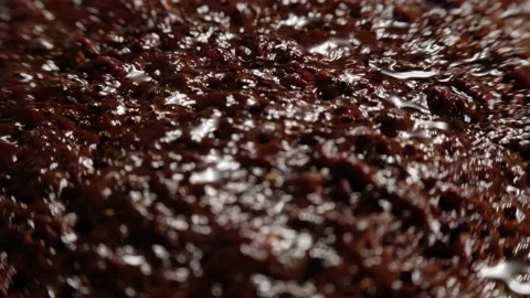Boiling chocolate sauce surface, shallow depth of field, close up, focus pull. Stock Footage 165236396