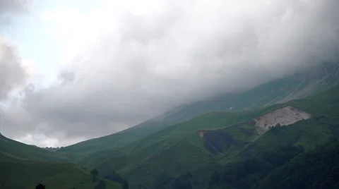 Boiling of Clouds Over the Mountain Pass. Timelapse Video stock 66276045