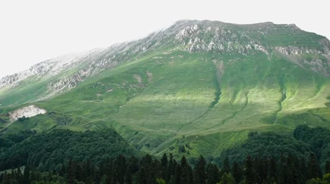 Boiling of Clouds Over the Mountain Pass. Timelapse Video stock 66276734