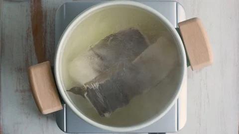 Boiling cod fish in pot Video stock 100635892