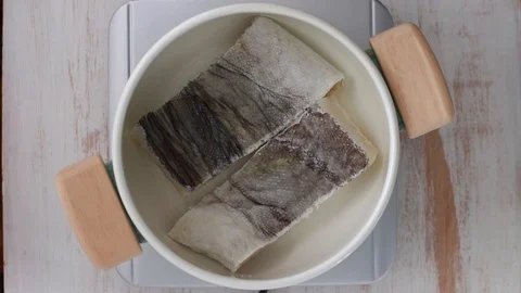 Boiling cod fish in pot Stock Footage 100635895