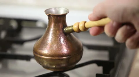 Boiling coffee on a gas cooker Stock Footage 60764276