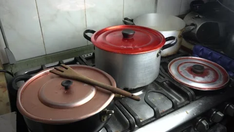 A boiling cooking pot about to overflow its contents Stock Footage 145575462