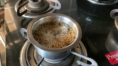 A boiling cup of tea simmering Stock Footage 226160260