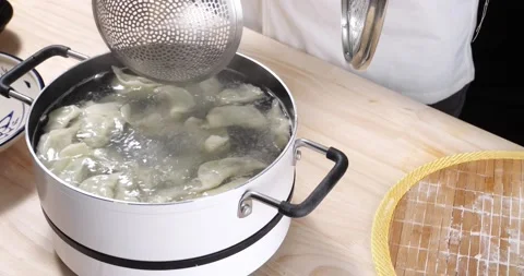 Boiling the dumpling Video stock 168612211