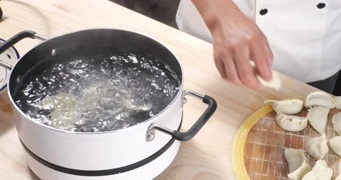 Boiling dumplings Stock Footage 168611810