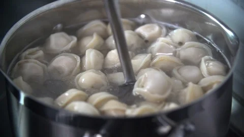 Boiling of a dumplings in slow motion Stock Footage 91905493