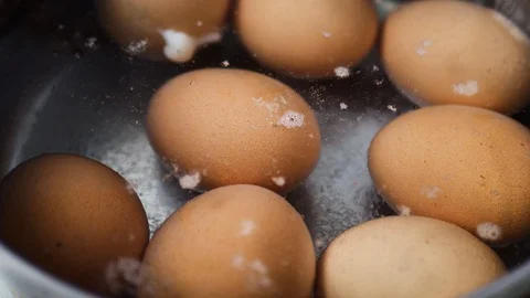 Boiling eggs in boiling water, cooking videos footage Stock Footage 129201003