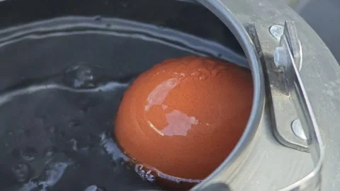 Boiling eggs in a kettle, camping. Stock Footage 306759693