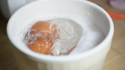 Boiling the eggs with a nelectric pot Stock Footage 276322997