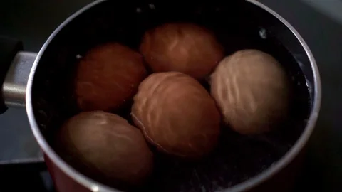 Boiling eggs in pan Stock Footage 109419007