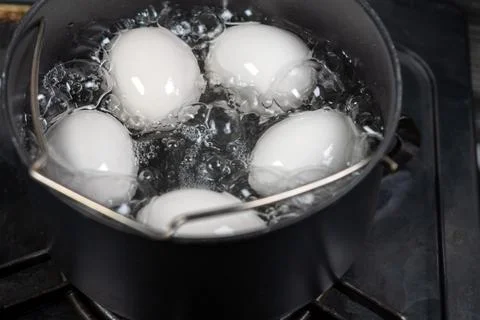 Boiling eggs Stock Photos