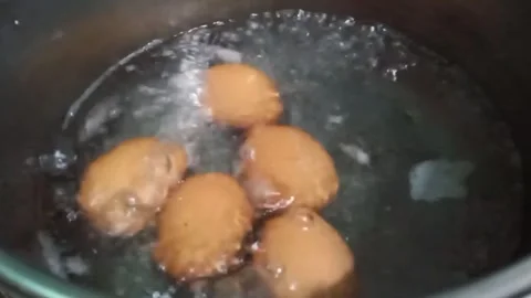 Boiling eggs in a pot Stock Footage 293796040