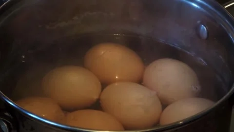 Boiling Eggs in Saucepan Close Up With Steam Stock Footage 324805848