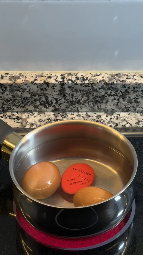 Boiling eggs with a timer Stock Footage 273408090