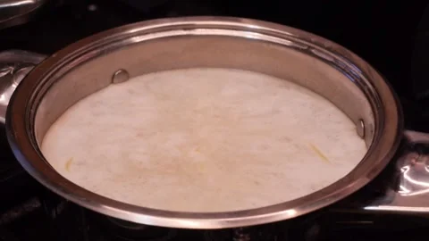 Boiling fresh pasta in pot Stock Footage 321837065