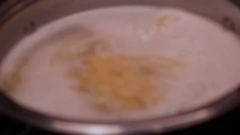 Boiling fresh pasta in pot full olf water Stock Footage 321837516
