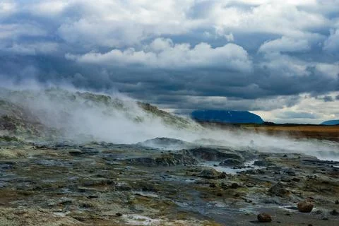 Boiling geothermal mud spot emitting sulfuric gases in Iceland Stock Photos