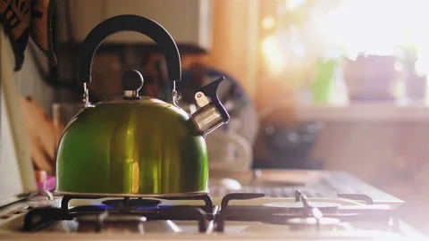 Kettle Boiling On A Gas Stove In The Kitchen. Focus On A Spout