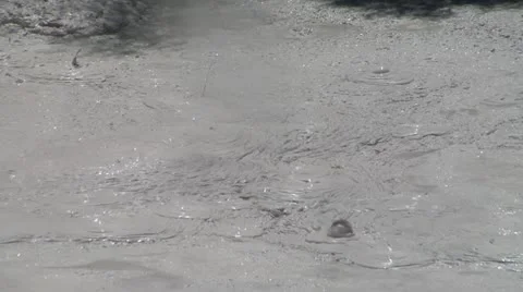 Boiling grey mud Stock Footage 21308711