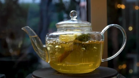 Boiling herbal tea, cinnamon, lemon Stock Footage 106626353