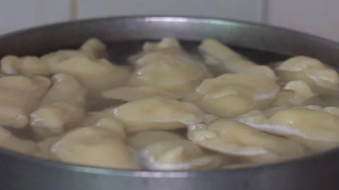 Boiling Homemade Dumplings in a Pot Stock Footage 336236327