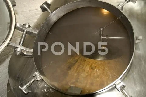 Boiling hot bitter (beer), in brewing vat. Stock Photos