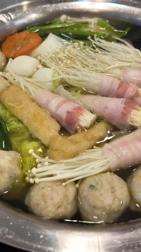 Boiling hot pot with assorted ingredients video frame Stock Footage 325650261