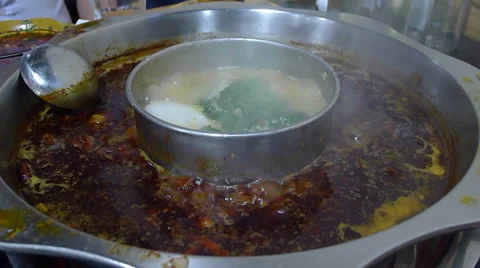 Boiling hot pot, so called huoguo, a famous traditional dish in Chengdu Stock Footage 41878799